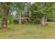 Lush green front lawn featuring a brick home in a scenic environment at 4074 Idlevale Dr, Tucker, GA 30084