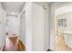 Hallway leading to a bathroom and bedrooms features hardwood flooring at 4074 Idlevale Dr, Tucker, GA 30084