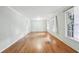 Spacious living room featuring freshly painted walls, hardwood floors and plenty of natural light from the windows at 4074 Idlevale Dr, Tucker, GA 30084