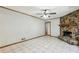 Bright living room features stone fireplace, tile floors, and backyard access at 4074 Idlevale Dr, Tucker, GA 30084