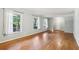 Living room with hardwood floors, freshly painted walls, and updated windows providing ample natural light at 4074 Idlevale Dr, Tucker, GA 30084