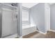Bathroom with glass shower, garden tub, and modern fixtures at 6297 Polar Fox Ct, Riverdale, GA 30296