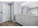 Bathroom featuring double vanity, large mirror and modern fixtures at 6297 Polar Fox Ct, Riverdale, GA 30296
