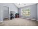 Empty bedroom with a vaulted ceiling and closet at 6297 Polar Fox Ct, Riverdale, GA 30296