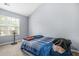 Spare bedroom with slanted ceilings and a large window at 6297 Polar Fox Ct, Riverdale, GA 30296