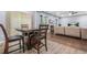 Open concept dining area featuring a table with chairs, leading into a cozy living space at 6297 Polar Fox Ct, Riverdale, GA 30296