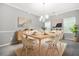 Elegant dining room featuring a stylish table, modern chandelier, and tasteful decor at 6297 Polar Fox Ct, Riverdale, GA 30296