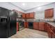 Functional kitchen equipped with modern appliances, ample cabinet space, and tile backsplash at 6297 Polar Fox Ct, Riverdale, GA 30296