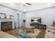Spacious living room showcasing a fireplace, hardwood flooring, and a comfortable seating arrangement at 6297 Polar Fox Ct, Riverdale, GA 30296