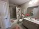 Charming bathroom featuring a shower-tub combo, stylish vanity, and decorative accents at 1001 Calypso Way # 1001, Cumming, GA 30040