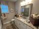 Bright bathroom featuring double vanity, granite countertops and a large mirror at 1001 Calypso Way # 1001, Cumming, GA 30040