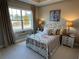 Nicely decorated bedroom with a window, stylish furnishings and carpeted floors at 1001 Calypso Way # 1001, Cumming, GA 30040