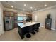 Modern kitchen featuring stainless steel appliances, a spacious island with seating, and ample counter space at 1001 Calypso Way # 1001, Cumming, GA 30040