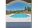 Serene swimming pool area, perfect for relaxation and recreation, with lounge chairs and clear blue water at 1001 Calypso Way # 1001, Cumming, GA 30040