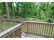 View of a wooden back deck overlooking the spacious backyard at 1025 Cheaves St, Forest Park, GA 30297