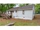 Home with a wooden deck, stairs, and backyard at 1025 Cheaves St, Forest Park, GA 30297