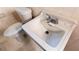 Close up of bathroom sink and toilet with running water at 1025 Cheaves St, Forest Park, GA 30297
