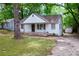 Charming home with a covered front porch and established trees at 1025 Cheaves St, Forest Park, GA 30297