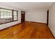 Inviting living room with hardwood floors, natural light, and neutral paint at 1025 Cheaves St, Forest Park, GA 30297