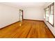 Bright living room with hardwood floors and natural light from the windows at 1025 Cheaves St, Forest Park, GA 30297