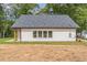 Rear exterior view of home featuring modern siding and new roof at 2621 Oldknow Nw Dr, Atlanta, GA 30318