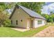 Charming home exterior with lush green lawn and ample natural light at 2621 Oldknow Nw Dr, Atlanta, GA 30318