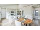 Open-concept kitchen and dining area featuring sleek appliances, island, and ample counter space at 2621 Oldknow Nw Dr, Atlanta, GA 30318