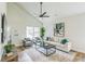 Cozy living area with modern decor and natural light, flowing seamlessly into the dining area at 2621 Oldknow Nw Dr, Atlanta, GA 30318
