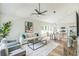 Bright, open-concept living area with modern furnishings flowing into dining and kitchen at 2621 Oldknow Nw Dr, Atlanta, GA 30318