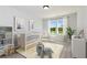Charming Bedroom with a crib, rocking chair, and plenty of natural light from the windows at 509 Altamaha Ct, Locust Grove, GA 30248