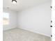 Bright bedroom with neutral carpet, white walls, and a window offering natural light at 736 Ocmulgee Xing, Locust Grove, GA 30248