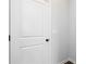 Bright white door with black hardware and light grey walls at 736 Ocmulgee Xing, Locust Grove, GA 30248