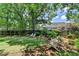 Inviting backyard featuring manicured lawn, landscaping, and cozy seating areas, ideal for relaxation and entertaining at 1830 Hadfield Blvd, Roswell, GA 30075