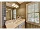 Bathroom with a long vanity, a sink, and a walk-in shower at 1830 Hadfield Blvd, Roswell, GA 30075