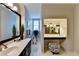 Bright bathroom with double vanity, mirrors, and recessed lighting, offering a clean, modern space at 1830 Hadfield Blvd, Roswell, GA 30075
