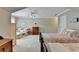 Inviting bedroom featuring twin beds, complemented by comfortable sitting area and storage at 1830 Hadfield Blvd, Roswell, GA 30075
