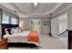 Bedroom with a queen bed, bedside tables, and an ensuite bathroom at 1830 Hadfield Blvd, Roswell, GA 30075