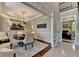 Formal dining room with chandelier, wainscoting, and hardwood floors, perfect for hosting gatherings at 1830 Hadfield Blvd, Roswell, GA 30075