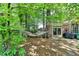 Relaxing hammock nestled between trees, offering a peaceful retreat in the shade of a lush backyard at 1830 Hadfield Blvd, Roswell, GA 30075