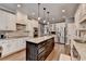 Open kitchen featuring granite countertops, stainless steel appliances, tile backsplash, and hardwood floors at 1830 Hadfield Blvd, Roswell, GA 30075