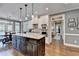 Bright kitchen featuring a center island, granite countertops, stainless steel appliances, and hardwood floors at 1830 Hadfield Blvd, Roswell, GA 30075