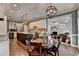 Open kitchen with dining area featuring a center island, stainless steel appliances, and access to the living room at 1830 Hadfield Blvd, Roswell, GA 30075