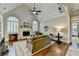 Spacious living room with vaulted ceiling, fireplace, and hardwood floors, great for relaxation at 1830 Hadfield Blvd, Roswell, GA 30075