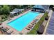 Community swimming pool with lounge chairs and manicured landscaping at 1830 Hadfield Blvd, Roswell, GA 30075