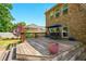 Relaxing deck and backyard featuring swing, steps, and flowering plants at 245 Tapestry Dr, Mcdonough, GA 30252