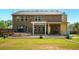 Large backyard with mature trees featuring a shed, arbor, and patio space at 245 Tapestry Dr, Mcdonough, GA 30252