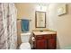 Cozy bathroom featuring a vanity, toilet, and tiled shower with curtain at 245 Tapestry Dr, Mcdonough, GA 30252
