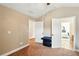 Neutral bedroom featuring neutral carpeting, a ceiling fan, and walk-in closet at 245 Tapestry Dr, Mcdonough, GA 30252