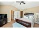 Comfortable bedroom featuring plush carpeting, a ceiling fan, and neutral paint at 245 Tapestry Dr, Mcdonough, GA 30252