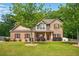 Charming two-story brick home features a well-manicured lawn, landscaped yard, and inviting curb appeal at 245 Tapestry Dr, Mcdonough, GA 30252